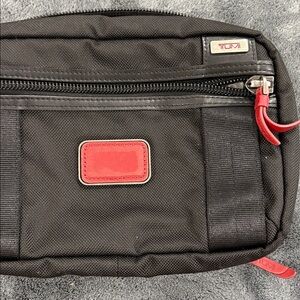 Tumi Black Pouch with Red Accents